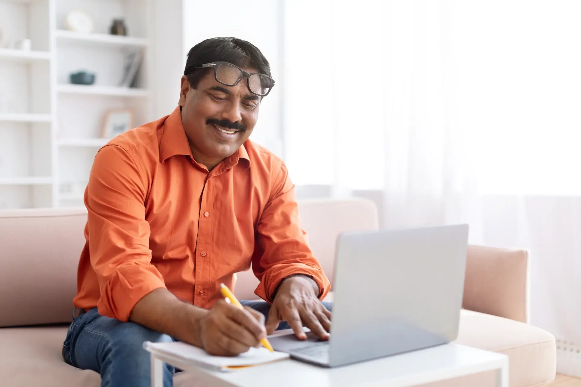 smiling-man-working-remotely-at-home-office-2026-01-08-23-09-07-utc