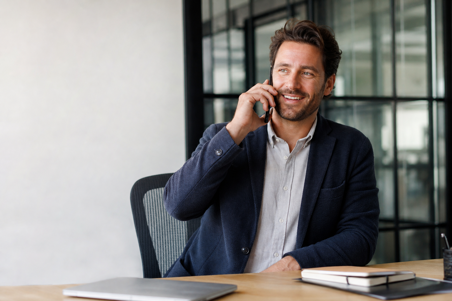 Man on Phone in Office Discussion
